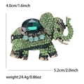 Spilla a elefante vintage in oro antico con strass verde smeraldo e pietre blu - Verde