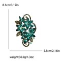 Elegant emerald crystal flower brooch in vintage bronze finish with detailed vine design - Green