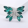 Sparkling butterfly brooch with emerald crystals and white cubic zirconia on white pedestal - Green (MM-BR-3805-GN)