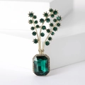 Close-up of emerald green crystal bouquet brooch with gold-plated plant stems - Green