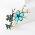 Vintage gold butterfly and flower brooch with turquoise stones and blue rhinestones - Blue