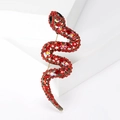 Elegante spilla a forma di serpente a S con strass rossi e cristalli su base in bronzo - Rosso