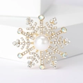 Elegante spilla a fiocco di neve dorata con perla bianca e cristalli su base bianca - Oro