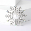 Elegante spilla a fiocco di neve con grande perla bianca e cristalli scintillanti - Argento
