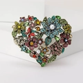 Detailed macro shot of a vintage floral heart brooch with colorful rhinestones and pearls - Multi-colored (MM-BR-3975-MX)