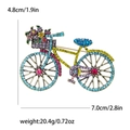 Goldene Fahrrad-Brosche aus Legierung mit bunten Strasssteinen und Blumen-Details - See Blau