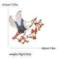 Elegant crane with plum branch enamel brooch in gold finish for women's suits - Gold