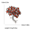 Spilla vintage in argento con bacche rosse e misure 5,8 cm x 4,8 cm sfondo bianco - Marrone