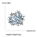 Silver branch brooch with light blue beads and white rhinestones on white background - Blue