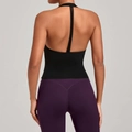 Back view of black halter yoga tank top and purple high-waisted leggings on model - S / Black