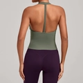 Deep green racerback yoga vest paired with high-waist purple sports leggings - S / Basil Green