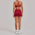 Dark red yoga set featuring criss-cross back sports bra and high-waisted shorts - S / Ruby Red