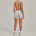 Light gray yoga bodysuit featuring a cross-back design and high-elasticity fabric - Warm Stone Grey