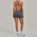 Dark grey cross-back yoga bodysuit with slim fit design for fitness and running - Coal Grey