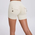 High-waisted scrunch butt yoga shorts in cream white with decorative back cargo pockets - S / Light Ivory