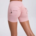 Pink high-waist yoga shorts with scrunch butt lifting effect and cargo pockets - Peach Pink