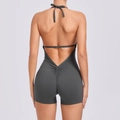 Tight-fitting backless yoga bodysuit in dark grey with ruched butt lifting detail - Dark Gray
