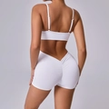 White two-piece yoga set featuring a V-waist scrunch butt shorts and backless sports bra - S / White