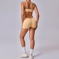 Nude peach lift yoga set featuring a backless sports bra and scrunch butt shorts - S / Nude