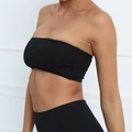 Seamless black strapless yoga tube top bra with elastic fit for fitness on model - S / Black