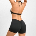 Black two-piece yoga bodysuit with halter neck top and high-waisted scrunch yoga shorts - L / Black