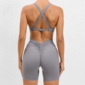 Two-piece gray yoga set with cross back sports bra and scrunch leggings for fitness - Dark Gray