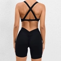 Two-piece black yoga set with cross-back sports bra and high-waist scrunch booty shorts - Black