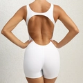 White sleeveless yoga bodysuit with open back cutout and compression fit fabric - S / White