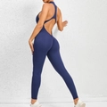 Dark blue yoga jumpsuit featuring open back with cross straps and ruched butt-lifting detail - S / Navy Blue