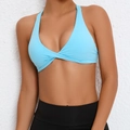 Light blue twist-front halter sports bra paired with high waisted black leggings - S / Sky Blue