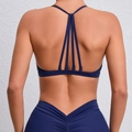 Dark blue yoga set with multi-strap sports bra and high-waist V-cut leggings - S / Navy Blue
