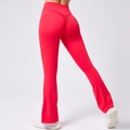 Detail view of high waist scrunch butt yoga flare pants in bright red with sleek finish - S / Bottoms / Red