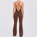 Deep coffee open back yoga jumpsuit featuring adjustable cross straps and flared leg design - S / Coffee
