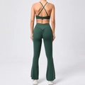 Detail view of high waist scrunch leggings with flared split hem in dark green fabric - S / Dark Green