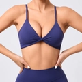 Dark blue yoga set featuring a twist-front sports bra and high-waist leggings with adjustable straps - S / Navy Blue