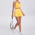 Women's yellow tennis workout set with cropped sports bra and pleated athletic skirt - Yellow