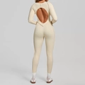 Slim fit cream long sleeve yoga jumpsuit with an open back and decorative seams - S / Beige