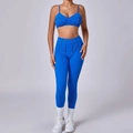 Blauwe tweedelige yogaset met slanke beha en legging met hoge taille en sierstiksels - S / Saffierblauw