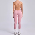 Pink backless yoga bodysuit with criss-cross straps and peach hip lift design - Medium Rose Pink