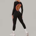 Zwart dames yoga bodysuit met lange mouwen, roze stiksels en open rug detail - M / Zwart en Roze