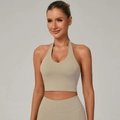 Women's beige halter neck sports bra and ribbed yoga leggings set for fitness - S / Flaxen