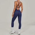 Marineblauwe yoga jumpsuit met verstelbare kruisbandjes en een slanke pasvorm - S / Medaillonblauw