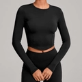 Strakke zwarte cropped yoga top met lange mouwen van hoogwaardig elastisch materiaal - XS / Zwart