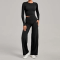 Two-piece black yoga set with long sleeve crop top and high-waisted wide leg pants - XS / Black