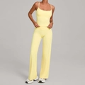 Two-piece yoga set with light yellow spaghetti strap top and high waisted wide leg pants - Durian Yellow