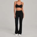 Women's black yoga set featuring a V-neck sports bra and high-waisted flared leggings - S / Black