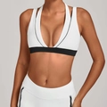 White halter yoga bra with black contrast trim and deep V-neck for fitness workouts - S / White