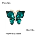Elegante spilla a farfalla con cristalli verde smeraldo e lega dorata con strass bianchi - Verde