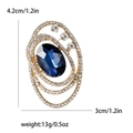 Elegante broche ovalado de cristal azul con pedrería blanca en montura dorada - Azul (MM-BR-4168)