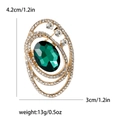 Broche vintage dorado con esmeralda óvalo y pedrería blanca, tamaño de 4,2cm por 3cm - Verde (MM-BR-4168)